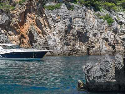 anchored motor yacht next to the blue cave on Kolocep island in Dubrovnik