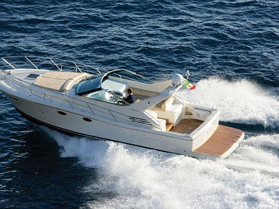 Skipper driving a white speedboat