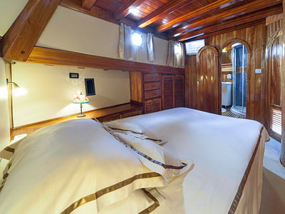 Large bed inside a guest cabin with an ensuite bathroom