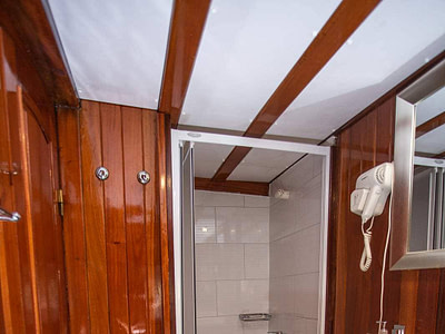 Luxury wooden bathroom with a shower onboard a gulet