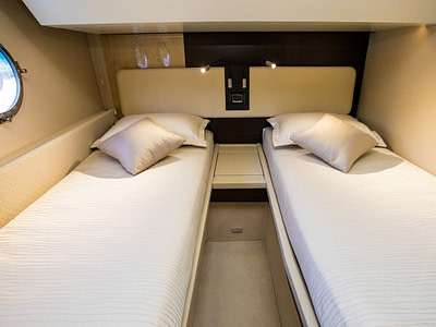Two single beds in a guest cabin on a yacht